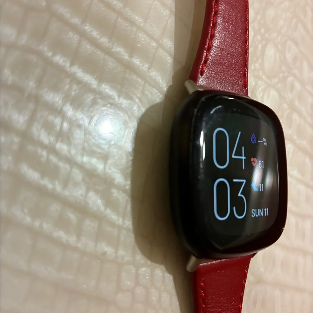 Fitbit Smartwatch with Red Strap